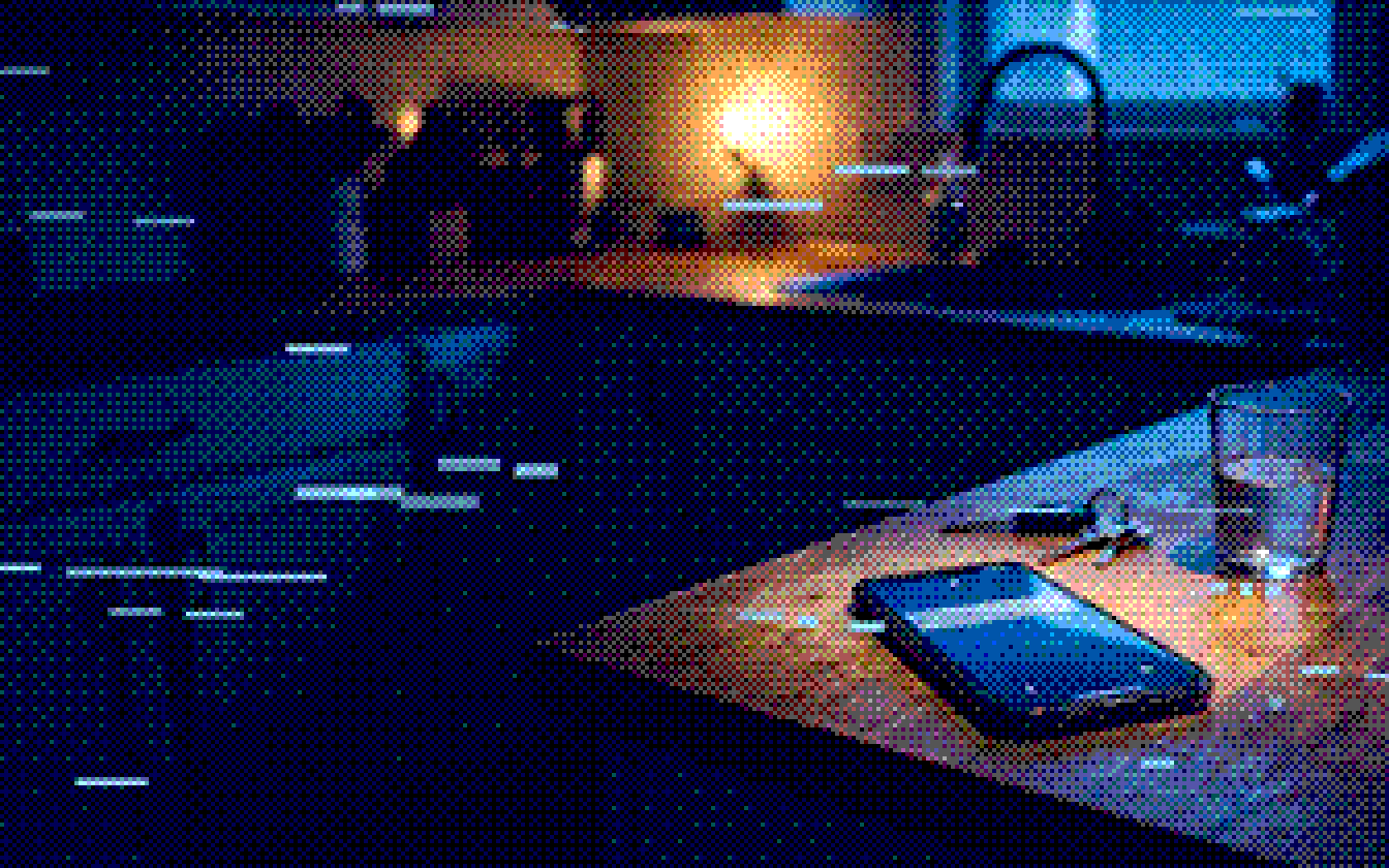 A phone lighting up with a new lead on a kitchen counter at night