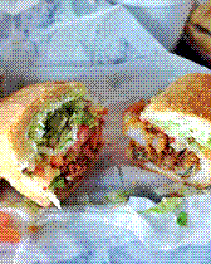 A fried shrimp and oyster po'boy, cut in half